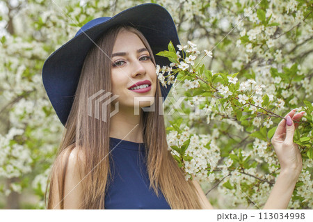 Charming brunette woman portrait. Beautiful female model with long hair and make-up 113034998