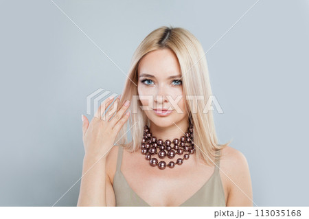 Perfect young blonde lady with fresh clear skin and long smooth straight hairstile  113035168