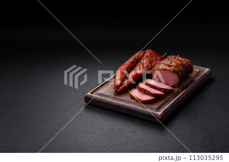 Delicious smoked meat pork or chicken with salt, spices and herbs Delicious smoked meat pork or chicken with salt, spices and herbs 113035295