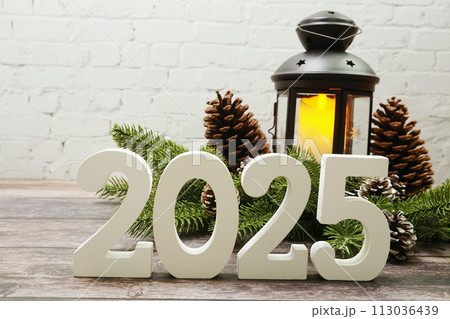 2025 Happy New Year with christmas lantern decorative with space copy on wooden background 2025 Happy New Year with christmas lantern decorative with space copy on wooden background 113036439