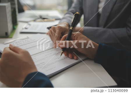 Business Signing a Contract Buy - sell house, insurance agent analyzing about home investment loan Real Estate concept. Business Signing a Contract Buy - sell house, insurance agent analyzing about home investment loan Real Estate concept. 113040099