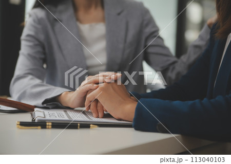 Lawyer, legal advisor, businessman brainstorming information on agreement details Business contracts in legal processing books for accuracy in contract documents. joint financial investment. 113040103