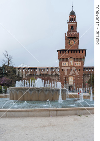 Sforzesco castle and fountain at overcast day Sforzesco castle and fountain at overcast day 113040601