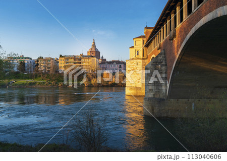 Panorama of covered bridge and Pavia cathedral at sunny day Panorama of covered bridge and Pavia cathedral at sunny day 113040606