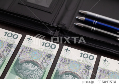 Polish paper banknotes stacked on the table, ready to start the transaction. Polish paper banknotes stacked on the table, ready to start the transaction. 113041518