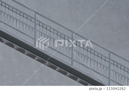 Gray metallic staircase, wall, up down going 113042262
