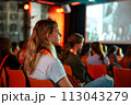 Audience Watching Movie in Chairs. June 30, Social Media Day 113043279