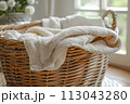 Wicker Basket With Blanket. spring cleaning, tidying, fresh start 113043280