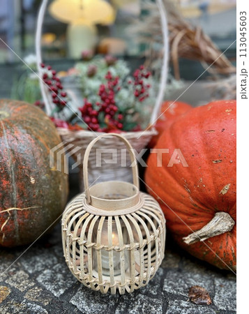 Autumn still life with pumpkins and lanterns in a rustic style Autumn still life with pumpkins and lanterns in a rustic style 113045603