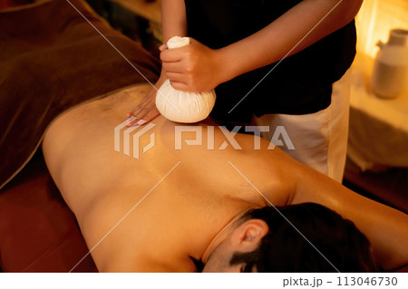 Hot herbal ball spa massage body treatment. Quiescent 113046730