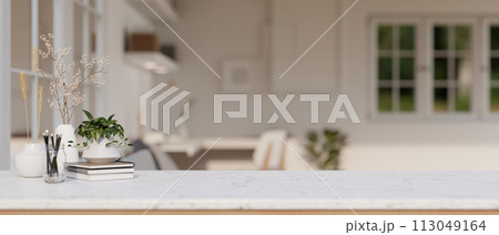 A white marble tabletop with a blurred background of a modern minimalist home office. 113049164