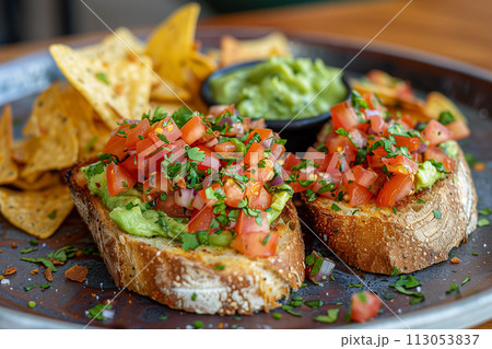 two slices of bread with avocado cream and nachos 113053837