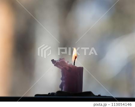 Candle light in the dark, close-up. Shallow depth of field 113054146