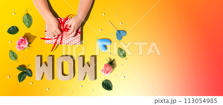 Little boy making a gift box for his mother Little boy making a gift box for his mother 113054985