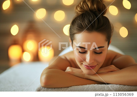 Woman having massage in the spa salon. Body massage treatment. 113056369