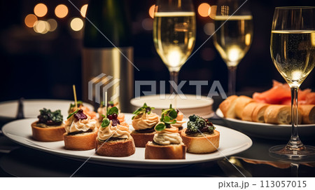 Christmas holidays and New Year celebration, dinner table at a luxury English styled restaurant or hotel, wine, appetisers and Christmas tree decoration, holiday party and event invitation Christmas holidays and New Year celebration, dinner table at a luxury English styled restaurant or hotel, wine, appetisers and Christmas tree decoration, holiday party and event invitation 113057015