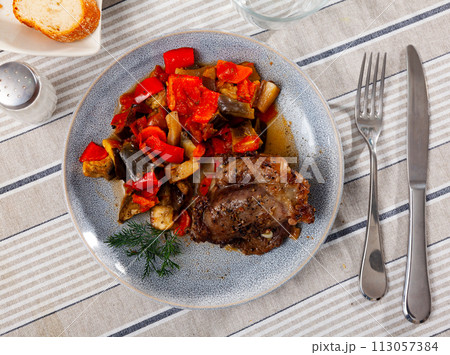 Baked pork cheek with stewed vegetables 113057384