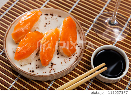 Sushi set of nigiri, served on rectangular plate Sushi set of nigiri, served on rectangular plate 113057577