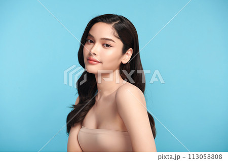 Beautiful Young transgender woman with clean fresh skin on blue background, Face care, Facial treatment, Cosmetology, beauty and spa, transgender women portrait. 113058808