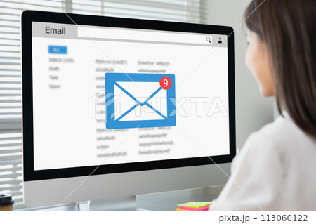 Businesswoman sitting using computer with checking email inbox on website. 113060122