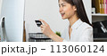 female hand holding credit card and type on laptop keyboard with online payment for shopping. 113060124