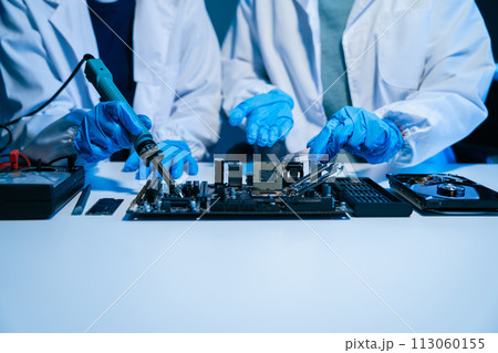 Close up of Technician measuring voltage electronic circuit board, Service after sale fix electric equipment. 113060155