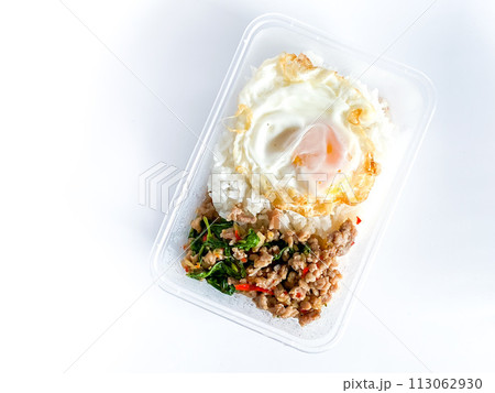 Rice topped with pork with Thai basil and fried egg 113062930