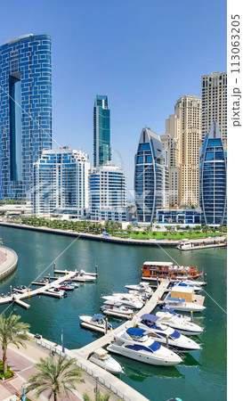 Panoramic view of Dubai Marina, Dubai Marina is an artificial channel with a length of 3 km, laid along the coastline of the Persian Gulf 113063205