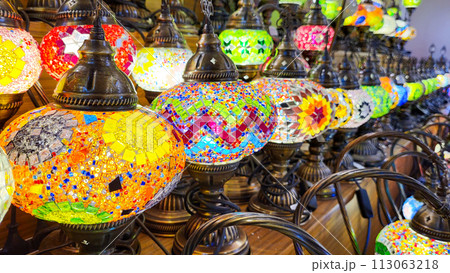 Multicolored pendant lights in oriental style. Beautiful mosaic of colored glass. Turkish multicolored lamps Multicolored pendant lights in oriental style. Beautiful mosaic of colored glass. Turkish multicolored lamps 113063218