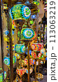 Beautiful lamps in Arabic style. Colorful hanging lanterns in traditional Arabic style handmade in the souvenir shop 113063219