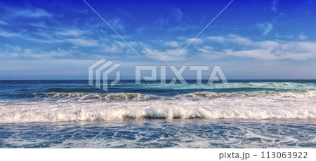 Big breaking Ocean wave on a black sandy beach on Pacific ocean Big breaking Ocean wave on a black sandy beach on Pacific ocean 113063922