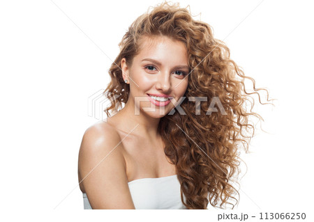 Isolated woman face. Young model with healthy skin, long hair and makeup on white background 113066250