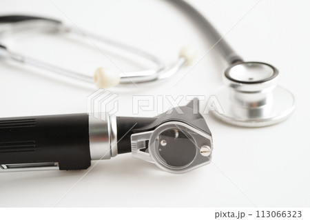 Otoscope isolated on white background for otolaryngologist or ENT physician doctor examining senior patient ear, hearing loss problem. Otoscope isolated on white background for otolaryngologist or ENT physician doctor examining senior patient ear, hearing loss problem. 113066323