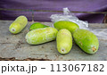 fresh green cucumbers on a wooden table 113067182