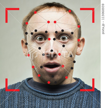 Shocked man with technology biometric security system. Facial recognition concept 113068939