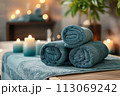 Towels on massage table in spa salon 113069242
