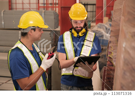 Team of engineers working at the factory 113071316