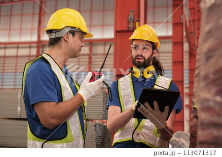 Team of engineers working at the factory 113071317