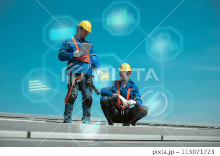 Engineers install solae cell on the roof of factory 113071723