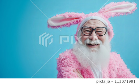 stylish Senior man in Easter bunny costume smiling positive emotions blue background with place for text 113071991