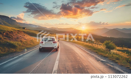 Car moves on a mountain road on a summer sunny day Car moves on a mountain road on a summer sunny day 113072262