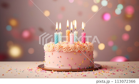 Pink birthday cake with candles on pastel background with lights 113072366