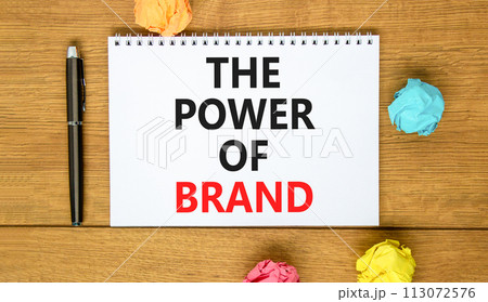 The power of brand symbol. Concept words The power of brand on beautiful white note. Beautiful wooden table background. Colored paper. Black pen. Business the power of brand concept. Copy space. The power of brand symbol. Concept words The power of brand on beautiful white note. Beautiful wooden table background. Colored paper. Black pen. Business the power of brand concept. Copy space. 113072576