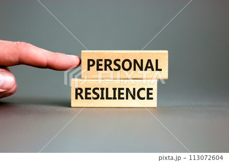 Personal resilience symbol. Concept word Personal resilience on wooden blocks. Beautiful grey table grey background. Businessman hand. Business psychological personal resilience concept. Copy space. Personal resilience symbol. Concept word Personal resilience on wooden blocks. Beautiful grey table grey background. Businessman hand. Business psychological personal resilience concept. Copy space. 113072604