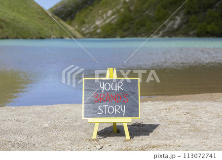 Branding and your brand story symbol. Concept words Your brands story on beautiful black chalk blackboard. Beautiful mountain lake background. Business branding your brand story concept. Copy space. 113072741