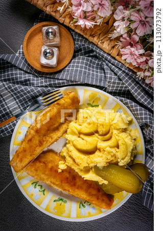 Fried pieces of breaded zander. 113073792