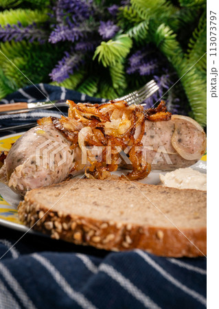 Fried white sausage with onion. Fried white sausage with onion. 113073797