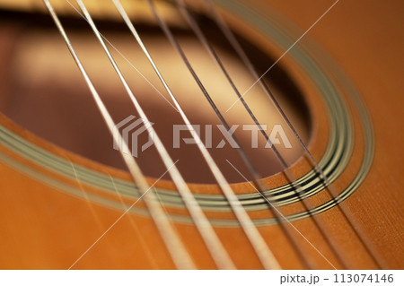 Acoustic guitar sound hole close-up view macro Acoustic guitar sound hole close-up view macro 113074146