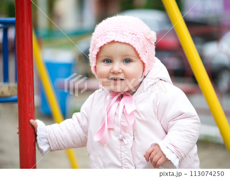 cute little baby girl on the playground 113074250