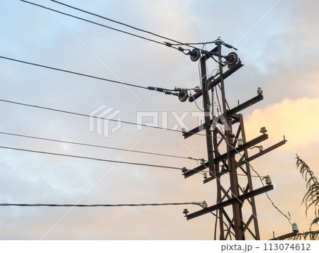 Tower with wires. Power line. Old wire pole. 113074612